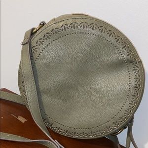 This is an army green canister purse.